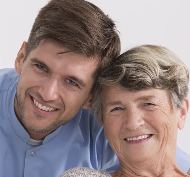 Professional respite caregiver staying with an elderly person at home