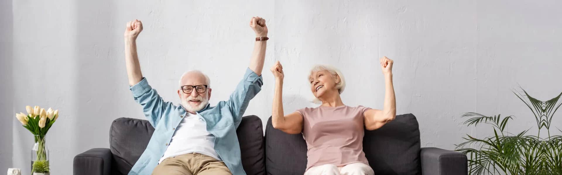 Happy elderly couple reviewing senior care resources together
